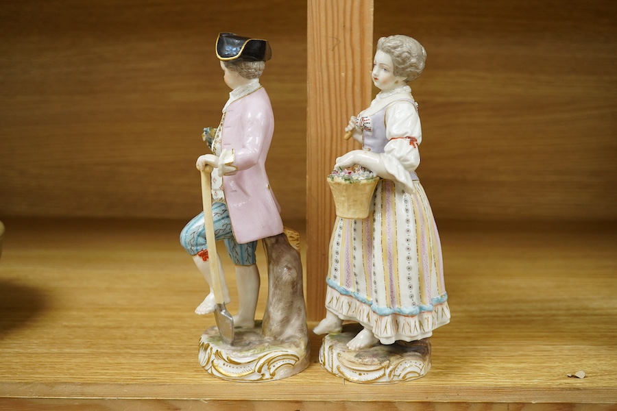 A pair of Meissen style porcelain figures of flower sellers, largest 20.5cm high. Condition - fair, some chipping and losses